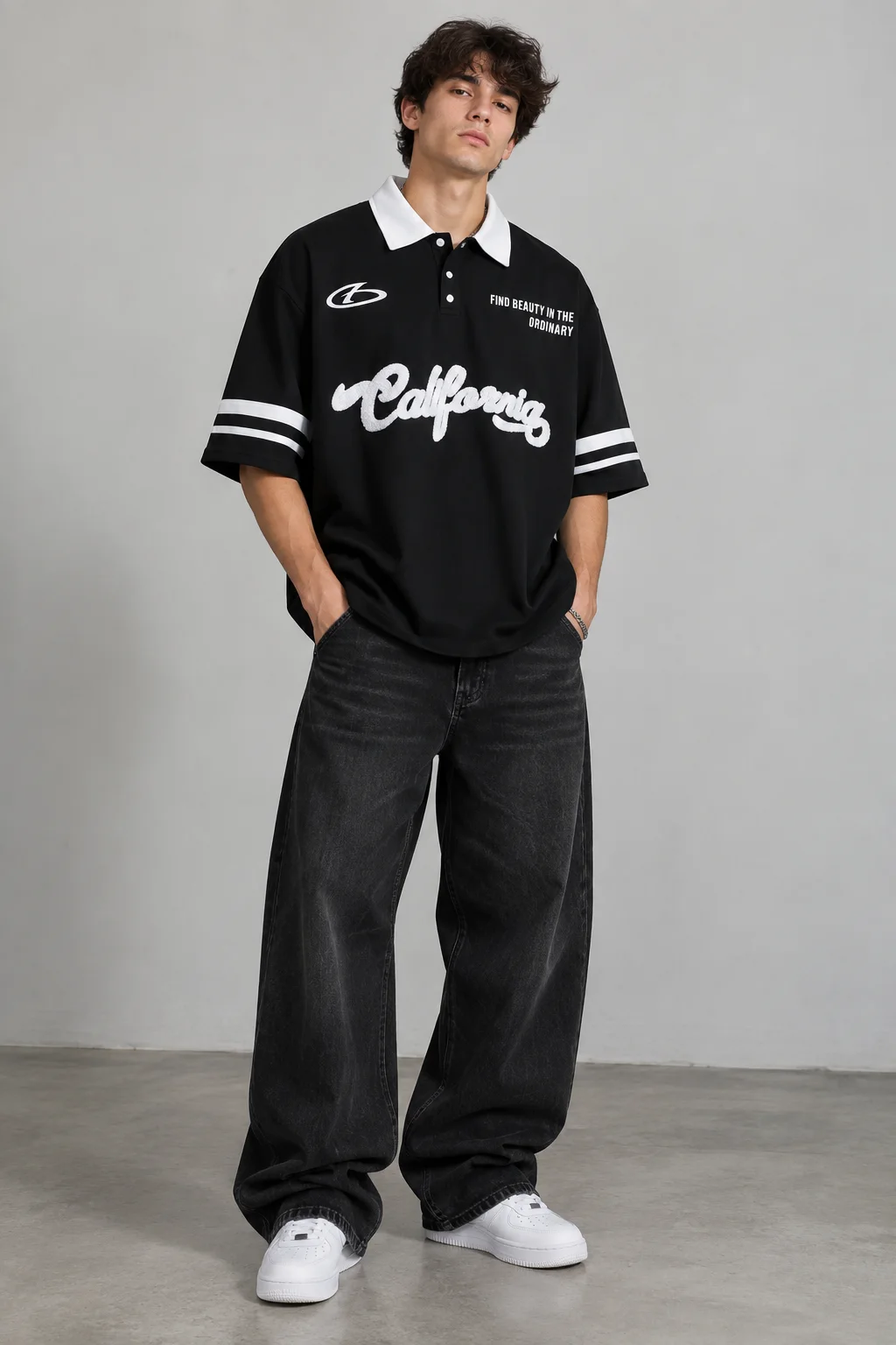 Model wearing a black oversized graphic polo jersey with a white collar